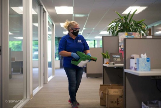 Janitors disinfecting cubicles